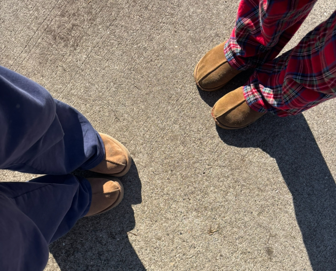 Two students' Spirit Day outfits are partially showcased with Uggs slippers and pajama pants. This week, students are dressing up in themes to celebrate the annual Homecoming spirit week. 