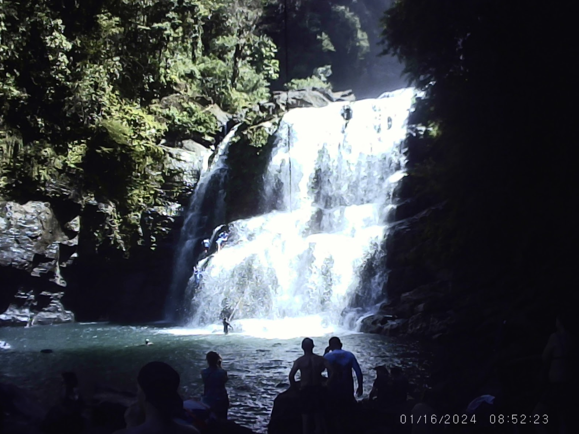 Students from the class of 2026 take in the beautiful view of a waterfall in Costa Rica. Many students report jumping off the waterfall as their favorite experience of the trip. 
