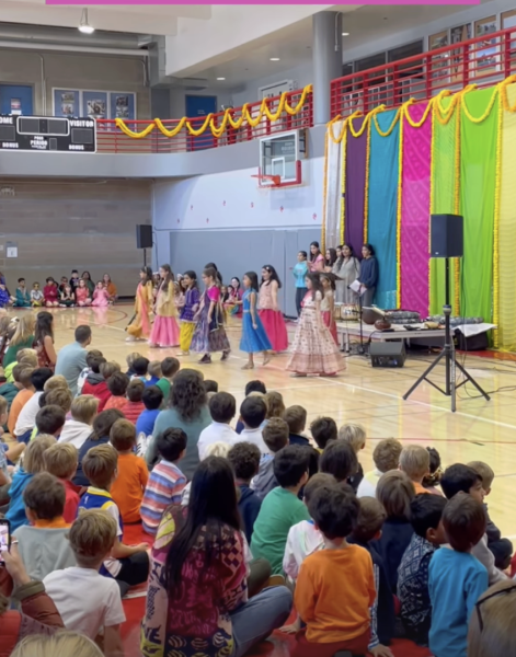 In the Herbert Center, fourth grade girls perform traditional Hindu dances. The tradition of spiritual dancing on Diwali goes back to 2nd Century BCE. 