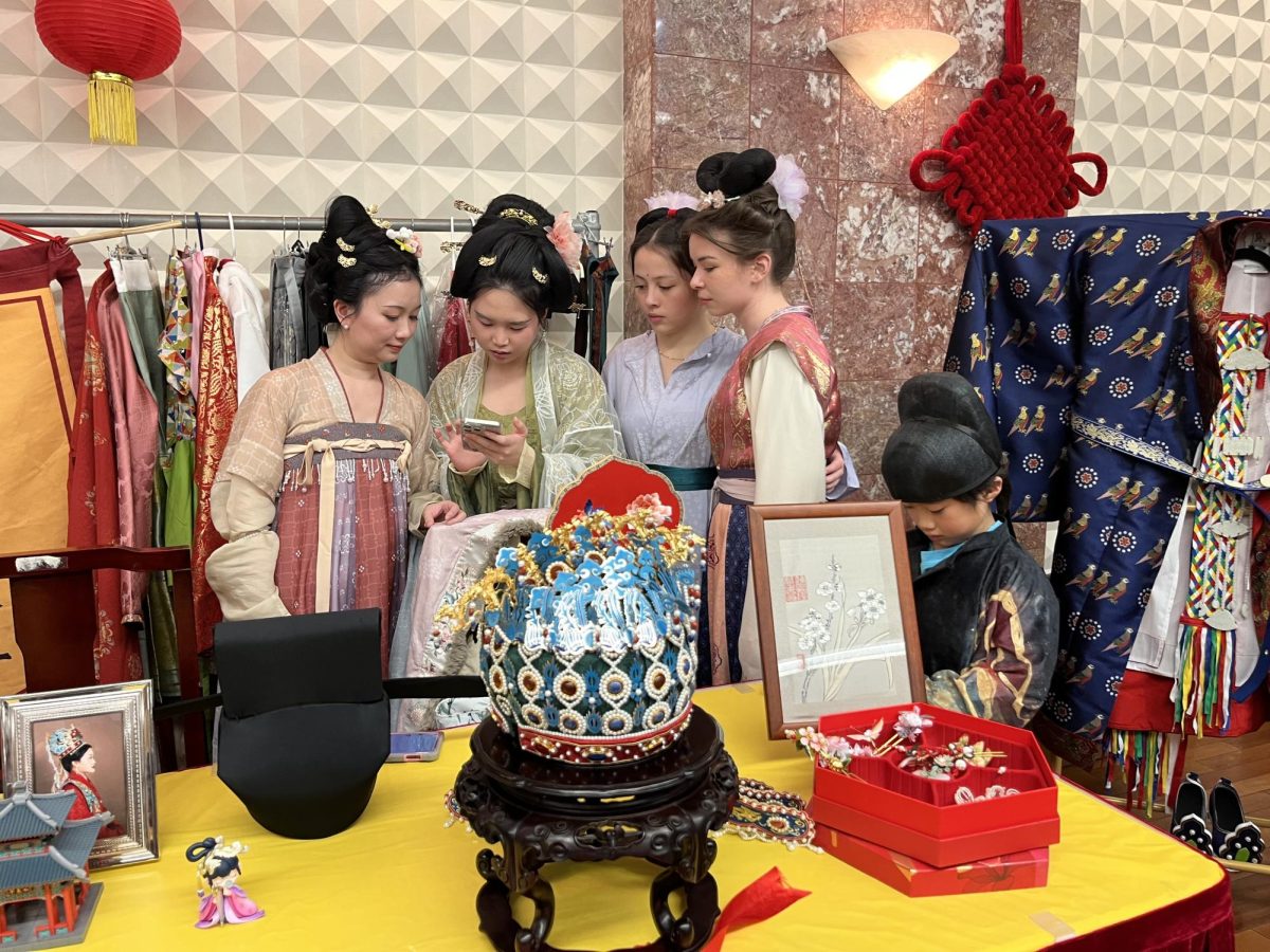 Students Gigi Franceschi and Charlotte Gesell dress up in traditional Hanfu clothing with other guests. The Consulate hosted an award ceremony that celebrated the many traditions as part of the Ming dynasty.