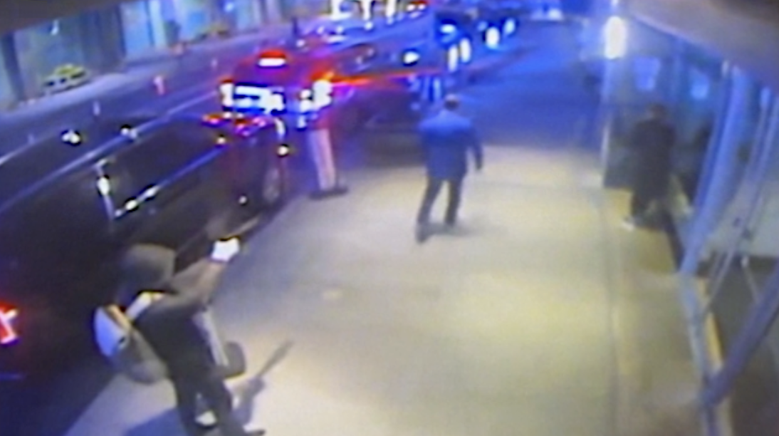 CCTV footage shows a hooded figure pointing a gun at Brian Thompson. This scene occurred moments before shots were fired.
