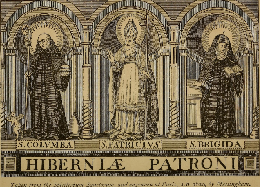 The patron saint of Ireland, Saint Patrick, stands with two other saints in a Catholic church. The bottom says “Hibernia Patroni”, which means “Patron Saint of Ireland” in Latin.