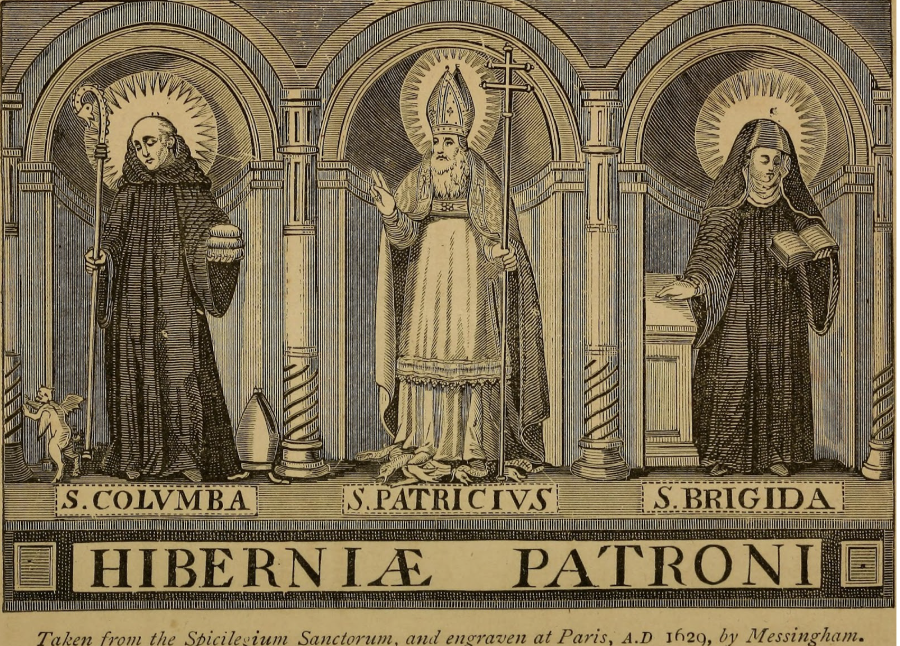 The patron saint of Ireland, Saint Patrick, stands with two other saints in a Catholic church. The bottom says “Hibernia Patroni”, which means “Patron Saint of Ireland” in Latin. 