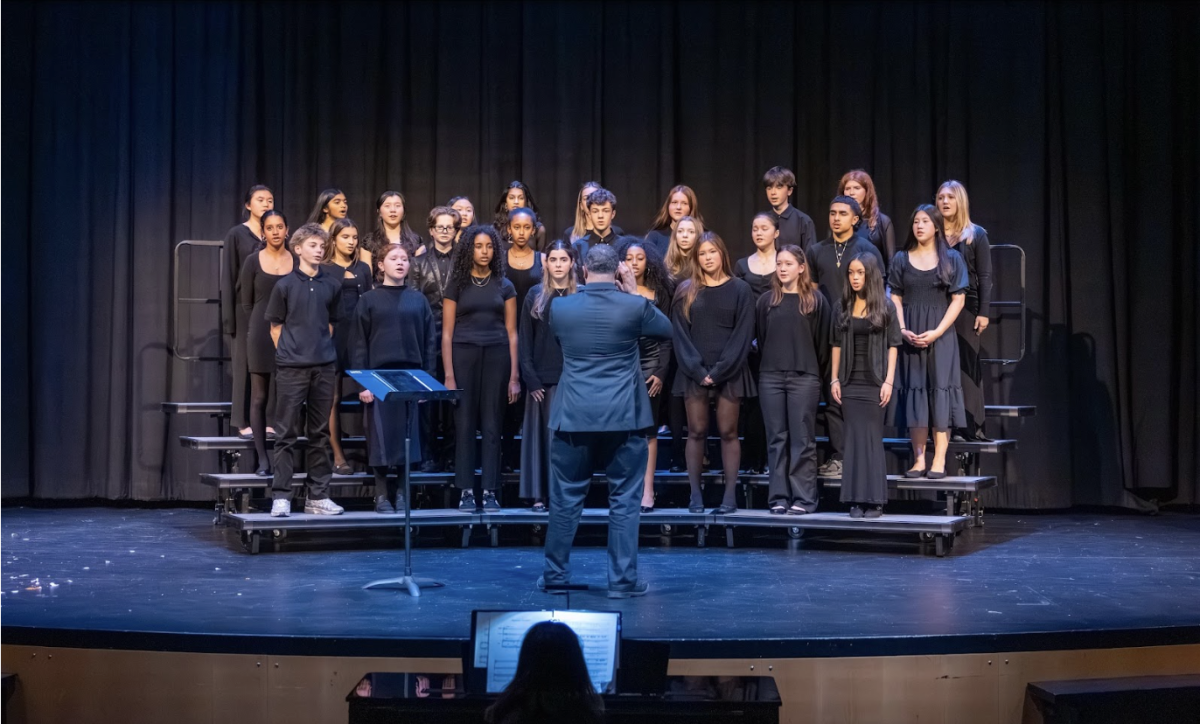 The vocal ensemble sings “Carol of the Bells” at the winter concert. Conducted by performing arts chair Phillip Harris, the ensemble performed alongside instrumentalists and the dance team.