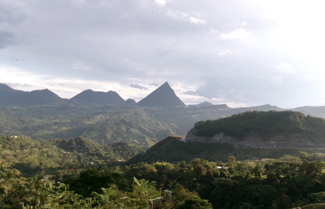 Cerro Tusa is the world’s largest natural pyramid, located in Colombia, easily identified by its pointy tip. During the bus ride from Jericó to Medellín, the group passed by and took photos with the iconic mountain.