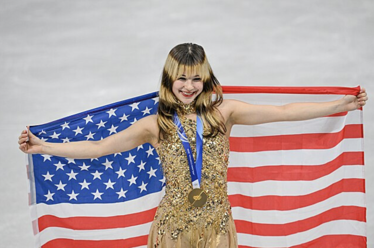 Alysa Liu was awarded gold during the medal ceremony for the individual women’s figure skating event. She showed her spirit by displaying the American flag.