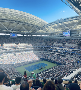 Arthur Ashe Stadium filled with tennis fans during the U.S. Open. The stadium is located at the Billie Jean King National Tennis Center in Flushing Meadows, Queens, New York. 
